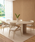 Velia – Table à manger ovale en travertin naturel avec piètement en V-Galerie Pietra